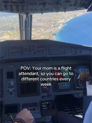 The image is taken from inside an airplane cockpit, looking out over a coastal landscape. The foreground is dominated by the various instruments and controls of the aircraft. The background shows a coastline, with the sea and a shoreline clearly visible under a bright sky. Overlaid on the image is text that reads, POV: Your mom is a flight attendant, so you can go to different countries every week.