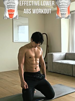A man with a muscular physique kneels on a workout mat, with a bare torso, showcasing his six-pack abs. The image is bright and well-lit, suggesting an indoor setting. Text overlay at the top reads 'EFFECTIVE LOWER ABS WORKOUT' in bold white letters, with a medical illustration of the abs on the left and right.