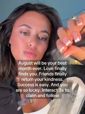 The cover image showcases a close-up of a woman’s face. The woman has dark hair, fair skin, and is wearing light-colored makeup. She is angled towards the camera. Her left hand is close to her face. Text overlay: August will be your best month ever. Love finally finds you. Friends finally return your kindness. Success is easy. And you are so lucky. Interact 3x to claim and follow.