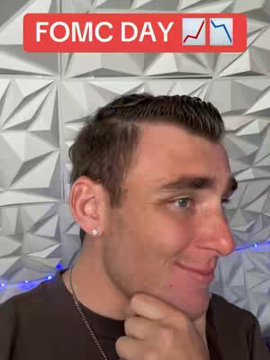 A man is looking towards the right, the background is a repeating raised geometric pattern and on the top part of the image is a red rectangle that has the text FOMC DAY with two arrows pointing up and down, as if to indicate the possible financial trends.