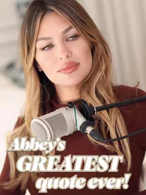 The image features a woman with long blonde hair, positioned in front of a microphone. Text overlayed says, "Abbey's GREATEST quote ever!" The lighting appears soft.