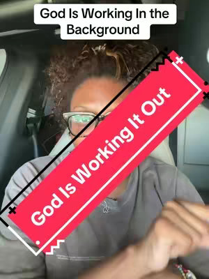 The cover image shows a woman in the driver's seat of a car. She wears glasses, and a black line and a red box overlay her. The red box contains the text 'God Is Working It Out'. Above her head is a smaller banner that says 'God Is Working In The Background'.