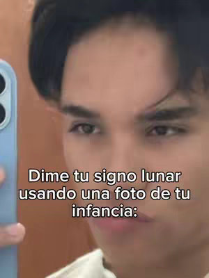 A person is holding a phone up taking a selfie, the scene is a close up of their face a text overlay is over imposed on the image.