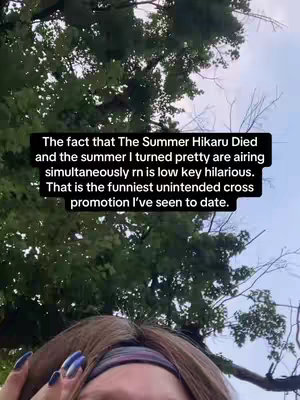 A selfie video featuring a woman with long brown hair, wearing a headband. The background includes out-of-focus trees and sky. Superimposed on the image is a black box containing white text.