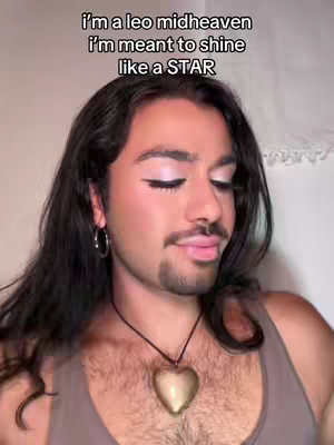 A selfie shows a person with long dark hair and makeup, a necklace, and a tank top. The text overlay says, 'I'm a leo midheaven I'm meant to shine like a STAR'.