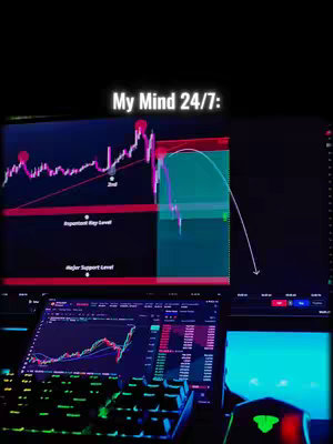 The image shows a dark setting with several computer screens displaying financial charts and data, evoking a trading or investment context.
