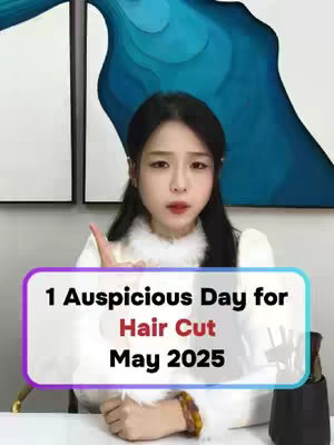 A woman is centered in the frame, gesturing with her right index finger. She's wearing a white, fluffy-collared top. A text overlay in a teal, white, purple, and black border indicates the video's subject. Background decor includes abstract blue artwork, and a blurred object that may be a perfume bottle.