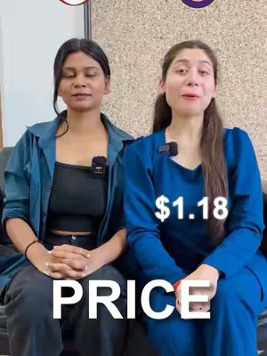 Two women are seated side-by-side, likely on a couch, with the left woman in a blue outfit and the right one in a a black outfit overlaid with a open blue shirt. The overlay text 'PRICE' spans the base of the image, and a price tag of '$1.18' is near their faces. The backdrop appears to be a light-colored wall with overhead elements.
