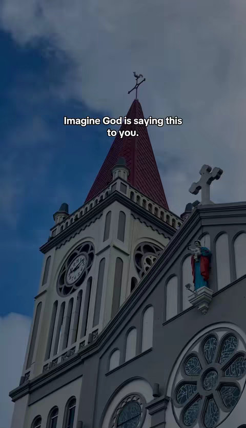 The cover image presents a tall church building against a backdrop of a cloudy blue sky. The church has a gray facade with a clock tower, a red roof, and ornate details. The text overlay reads, "Imagine God is saying this to you."