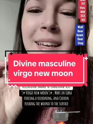 A woman with dark hair and a nose ring smiles directly at the camera, partially obscuring a red box containing text overlay indicating a new moon theme in astrology context. Additional text sits beneath that, on a black banner. Various other textual elements appear on the background.