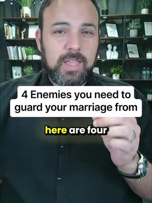 A selfie-style shot featuring a man in the foreground against a blurred interior background. The man, with a beard and short hair, is positioned with the camera at a medium angle, looking directly at the viewer. A text overlay is present, with the top text appearing in a white box with a black stroke and a yellow, bolded second line, offering the viewer information over a backdrop with indications of a home office, and other decor.