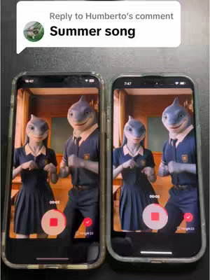 The cover image displays two smartphones side-by-side, each showing a video frame. The video features two anthropomorphic characters that appear to be sharks dressed in school uniforms. On the left phone, there's one shark character, and on the right phone, there are two. Above the phones is a speech bubble with the text, 'Summer song'. The phones are set against a dark background.