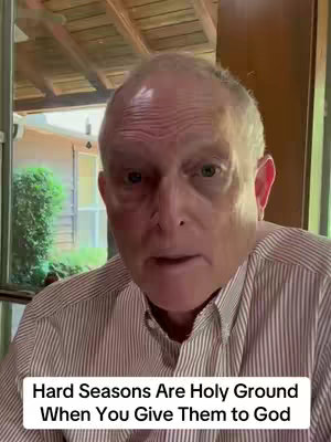 A medium shot shows a middle-aged man with thinning white hair, direct gaze, and light-colored skin. He's wearing a striped button-down shirt, positioned indoors. Below him is a white rectangular text overlay with black font.