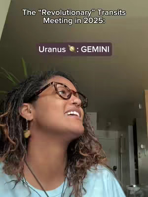 A woman with curly hair and glasses looks upward with a slight smile. Text overlays the image, indicating astrological transits.