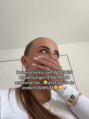 A woman with long light brown hair covers her mouth with her hand, looking to the side in a moment of surprise. Text overlays indicate the context of the shock, implying a career-related issue.
