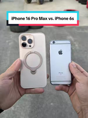 The image shows two smartphones held side-by-side by a person, the new iPhone 16 Pro Max on the left and an older iPhone 6s on the right. Both phones are light-colored, with the newer model displaying a ring accessory. The background is a blurred outdoor setting, and text overlays the image, with the title appearing in a turquoise layer.