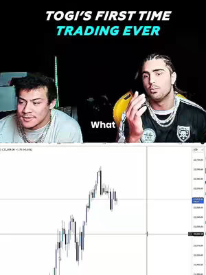 The image is a vertical composition. At the top, the title 'Togi's First Time Trading Ever' is written in a bold, white font with a teal highlight on top. A dark rectangle holds two men in a video-call style arrangement. The man on the left is wearing a white shirt and gold chain. The man on the right wears a black and yellow short-sleeve shirt and chain. Below, a trading chart is displayed, showing fluctuating candlestick data.