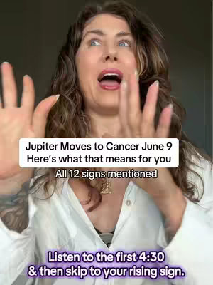 A woman with long, wavy brown hair and an open mouth is the main subject of the image. The background is blurred, and there are overlaid text elements. The woman's arms are up, and her hands are open as if emphasizing a point while directly facing the camera, suggesting she is speaking excitedly.