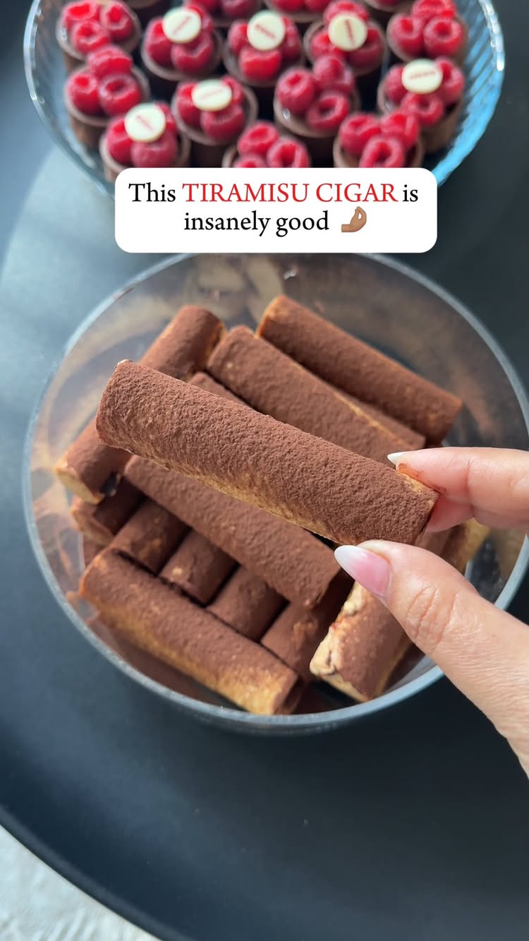 The cover image showcases a close-up view of a person's hand holding a tiramisu cigar, with a glass bowl of similar cigars in the background, and  a dish of tarts with toppings in the top back.