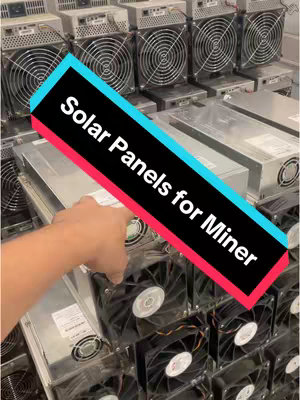 The image shows a hand reaching towards a device, probably an ASIC miner, which is part of a stack of similar devices. A diagonal text overlay with a black background and white text that reads "Solar Panels for Miner" is superimposed on the image. The background shows many identical devices in neat rows.