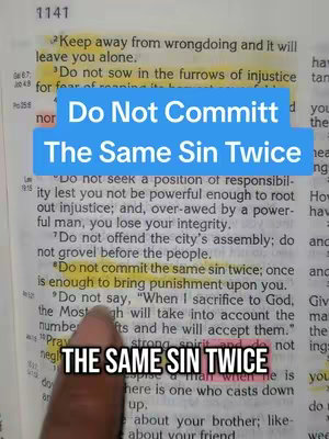 The image is a close-up of a Bible page, with text highlighted. Overlaid on the page are blue and black text boxes. A person's finger is visible, pointing to highlighted text.