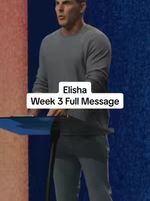 The cover image shows a man standing at a podium, possibly in a church or studio setting. The man is wearing a gray long-sleeve shirt and dark pants. He is looking forward with a neutral expression. A text overlay on the image reads "Elisha Week 3 Full Message". The background has a mix of blue and red tones, suggesting a lit stage or backdrop.