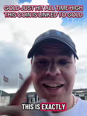 A man in a black cap is filming himself outdoors, pointing with his right index finger, with the text overlay in the top and middle. The background shows a partly cloudy sky.