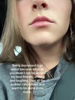 The image shows a close-up of a person's face, focusing on the lips and lower face. Overlaid text describes feeling depressed and the sudden shifts in mood, from enjoying friends to wanting to be alone. The person has fair skin, and the lighting appears soft.