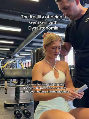 A young woman, seated in a gym, looks distressed while a man stands behind her, appearing to offer support. Text overlays describe the situation. The gym setting includes exercise equipment in the background.