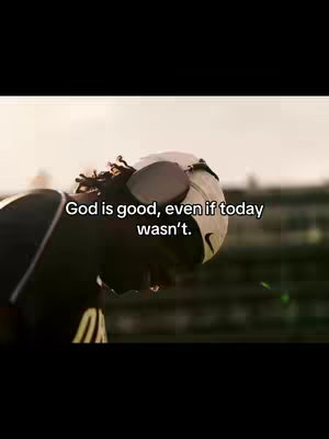 A somber image shows a person in a football uniform, face buried in the helmet. The background is blurred, likely a field, with sunlight creating a halo effect, while the text overlay brings a motivational message.
