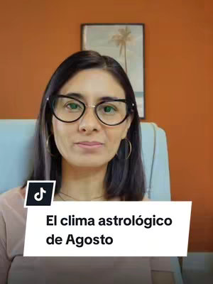 A woman with glasses is centered in the frame, with a warm orange background. She has dark hair and is wearing hoop earrings. A text overlay is at the bottom, using a white stylized shape for the text against it.