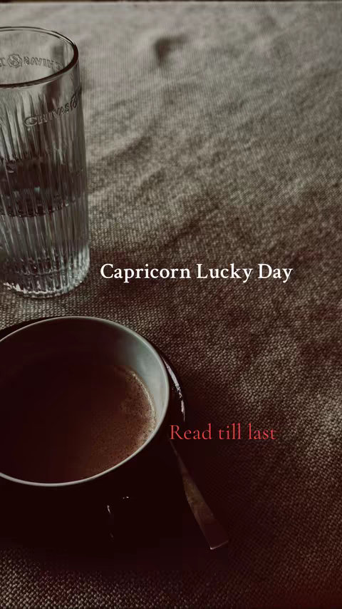 A sepia-toned image features a coffee cup, a glass of water, and a textured surface suggesting a table or cloth. The text overlay reads 'Capricorn Lucky Day' and 'Read till last'.