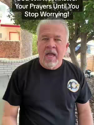 A man with gray hair and a beard is centered in the frame, set against an outdoor background featuring a building and foliage. Text overlaid across the top reads, 'God Will Not Answer Your Prayers Until You Stop Worrying!'