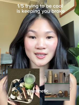 A young woman with long black hair is centered in the frame, looking towards the camera. Above her, text reads '1/5 trying to be cool is keeping you broke'. Insets show a tray with sunglasses, a drink, and toiletries on the left, and a shelf with beauty products on the right, with the word 'aesthetic' under the tray.