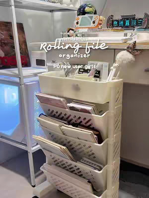 The cover image showcases a tidy desk setup featuring a white rolling file organizer filled with files and notebooks, styled in a minimalist aesthetic. Text overlays highlight the organizer and a promotional offer.