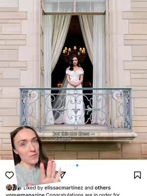 A woman with red-toned skin and auburn hair in a top and t-shirt is talking to the camera in front of a window with a bride on the balcony. The woman is making a thoughtful face with an overlay that says 'but this one dress - Vivienne'. The bottom-left corner has a circle with a heart icon, the person's profile, and the name of the profile 'voguemagazine' with other information to the bottom.