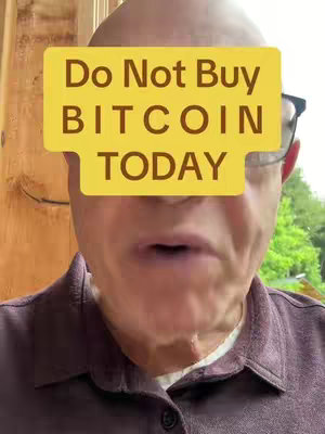 A man with a bald head and glasses is featured, with a yellow rectangle that reads, "Do Not Buy BITCOIN TODAY" obscuring his eyes; he has a shirt with dark colors.