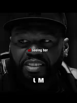 A black and white close-up of a man's face, with text overlays. The man is wearing a black cap and has a serious expression. The text "of seeing her" is in a red font and appears above the man's mouth, while the letters "L M" are at the bottom.