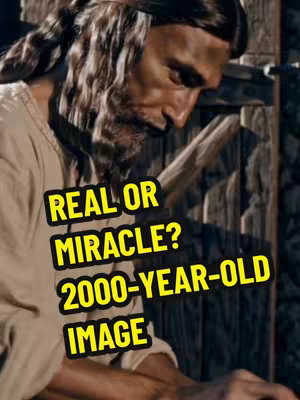 A man with long hair and a beard is the central figure, gazing downward with a serious expression. Bold, yellow text overlays the image, asking 'REAL OR MIRACLE?' and '2000-YEAR-OLD IMAGE.' The color scheme is warm, with the man's skin tones and the wooden background creating a natural, historical feel.