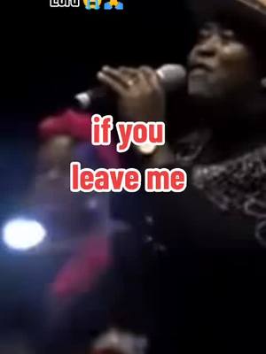 A shot of a performer on stage, holding a microphone and singing. Text overlayed on the image says "if you leave me". The image is somewhat blurry with dark colors.