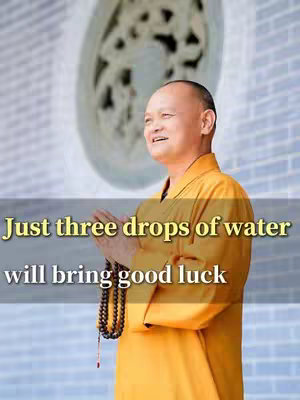 The image features a man in a yellow robe with his hands together. Text overlay indicates the video is about good luck.