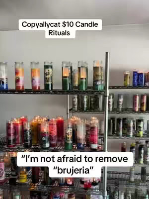 A vertical shot of shelves filled with candles of various colors and sizes. The top shelf has mostly cylindrical candles with colored wax or designs. The middle shelf has a mix of cylindrical and jar candles, lit and unlit, some with visible flames. The bottom shelf has an array of jar candles, many lit. Text overlays are present at the top and bottom of the frame in white rectangles.