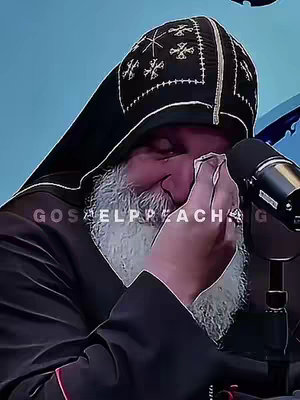The cover image shows a close-up of a man in religious attire, presumably a bishop. He is wearing a black robe and a tall, ornate black hat with gold and cross embellishments. He is holding a white cloth up to his face, possibly wiping away tears. His facial expression suggests deep emotion. In the background, there's a plain blurry blue area with the words "GOSPELPEACHING" diagonally written across the center. The overall composition is centered with a somber tone.