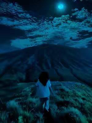 A woman walks toward a mountain with a bright moon in a dark, blue-toned landscape. Tall grass and a mountain fill the mid and background.