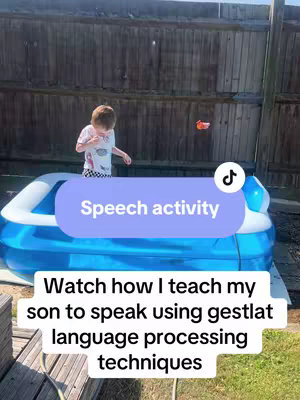 A video cover with a young boy standing in a small blue plastic pool in a backyard. The boy is wearing a white t-shirt with a black and white design. The background consists of a wooden fence and some trees. Overlaid on the image are text elements, including a speech bubble with text that says 'Speech activity', and a lower text bar with the video description.