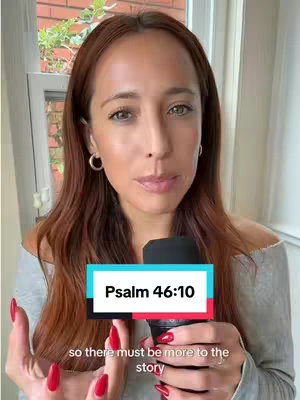 A woman with long auburn hair is centered in the frame, holding a microphone. Overlayed at the bottom is a text box that says, "Psalm 46:10". The background shows a bright exterior, with a window and plants visible.