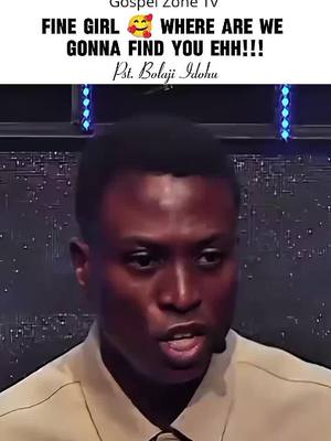 A medium shot of a man speaking to the camera, with overlaid text at the top. The man is wearing a light-colored shirt, with a microphone attached. The background is a dark, and blurry. The text overlay appears to be a quote or statement.