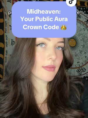 A selfie-style shot of a woman with long brown hair and blue eyes. She is centered in the frame. Overlayed on the top of the screen is a light purple box with white text that reads: 'Midheaven: Your Public Aura Crown Code' with a crown emoji. The background is blurred, but a portion of a spiritual tapestry with various symbols is visible, along with what appears to be a decorated sun.