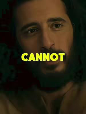 Close-up shot of a man's face, centered in the frame. The man has dark hair, a beard, and is looking towards the camera. A bright yellow text overlay that reads CANNOT covers his face.