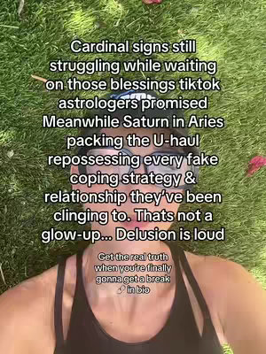 A person is lying on grass, the top half of their body visible. They wear a black tank top, and their face is visible, with sunglasses on the person's head. Text is overlaid on the image in a vertical format, with astrology-related content.